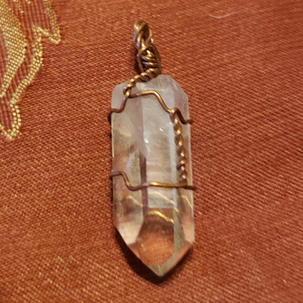 Water clear wire wrapped crystal point pendant.